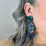 woman wearing acrylic Pendulum Drop Earrings in Force Of Nature, dark green, red, blue and green 