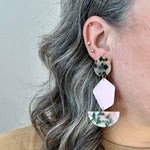 woman wearing acrylic Pendulum Drop Earrings in Keepin' It Wheel, green, pink, black and white tortise 