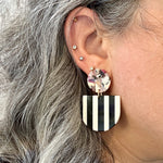 woman wearing acrylic Tab Drop Earrings in black and white stripe with multicolor