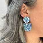 woman wearing acrylic Tab Drop Earrings in blue