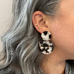 woman wearing acrylic Tab Drop Earrings in pearly tortoise