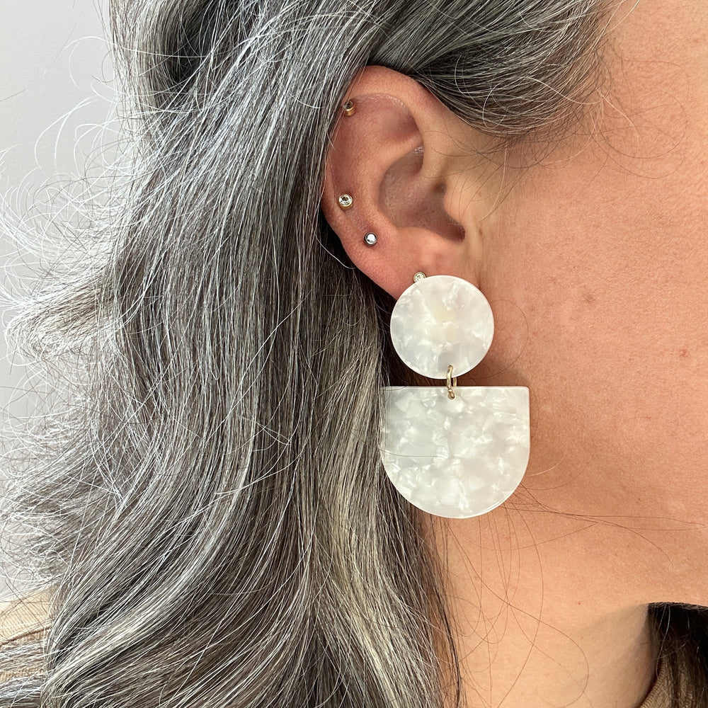 woman wearing acrylic Tab Drop Earrings in white