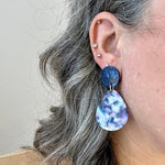 woman wearing acrylic Teardrop Earrings in Making Waves,  blue, pink, purple and white 