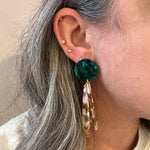 woman wearing acrylic flower Petal Drop Earrings in green, purple and brown