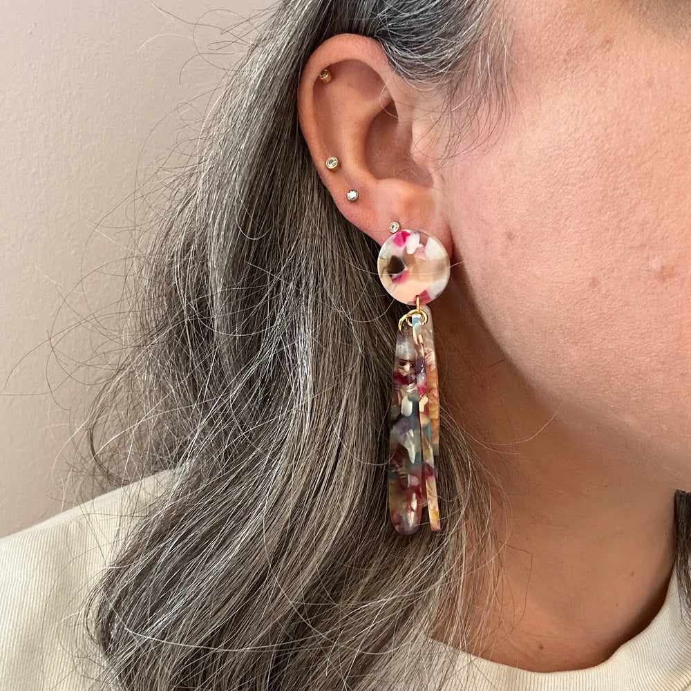 woman wearing acrylic flower Petal Drop Earrings in light multicolor