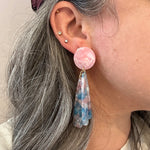 woman wearing acrylic flower Petal Drop Earrings in pink, blue and white