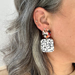 woman wearing small Acrylic Square Drop Earrings in You Crackle Me Up, black, white and light multicolor