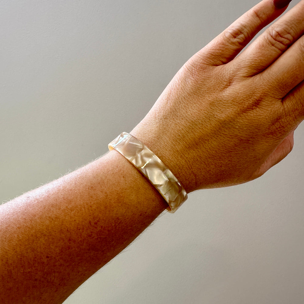 women wearing Medium acrylic Cuff in Pearly Beige