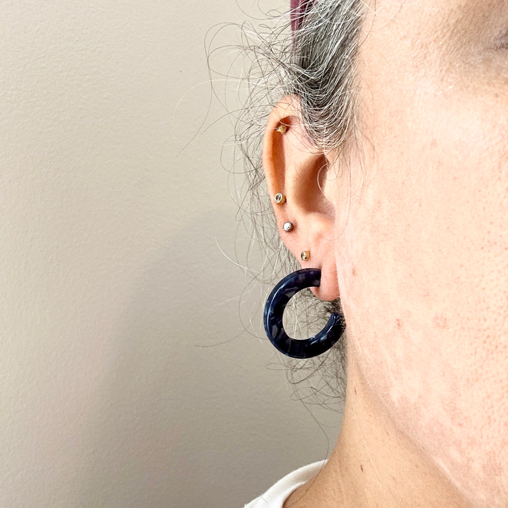 women wearing mini acrylic hoop earrings in navy