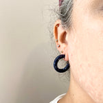 women wearing mini acrylic hoop earrings in navy