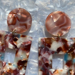 close up of Acrylic Square Drop Earrings in Fall Harvest, red, blue, brown and cream