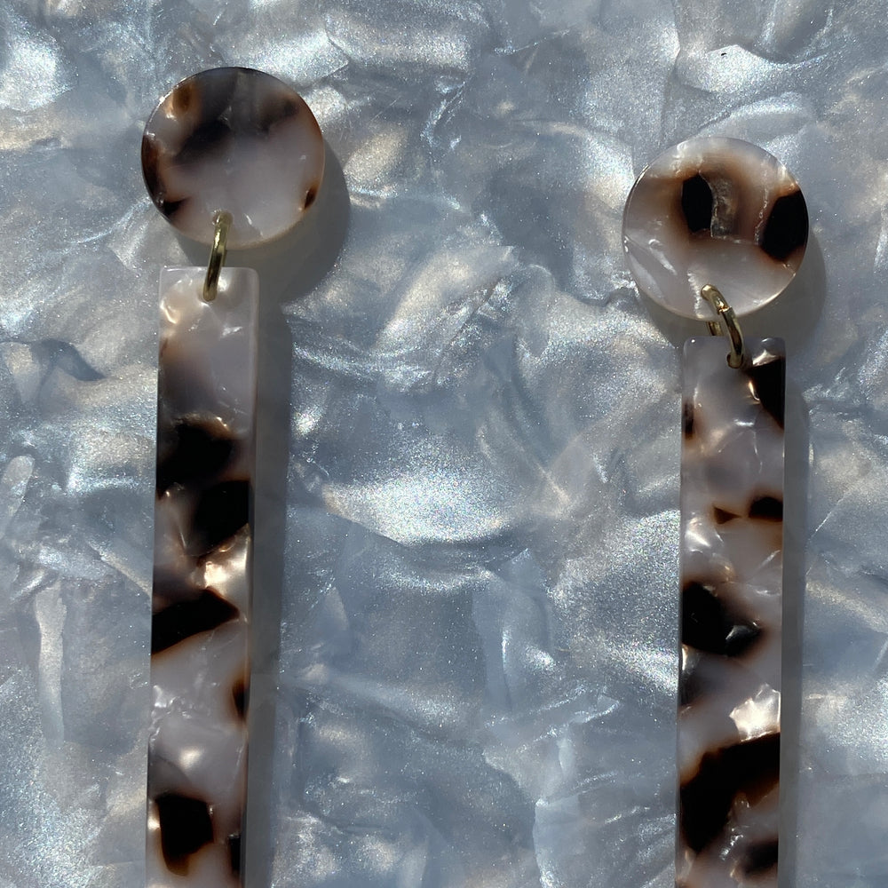 woman wearing acrylic Matchstick Drop Earrings in Pearly Tortoise