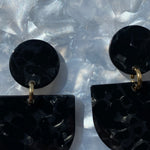 woman wearing acrylic Tab Drop Earrings in black