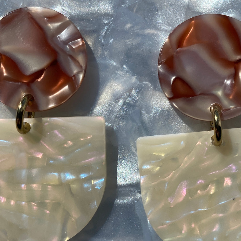 close up of acrylic Tab Drop Earrings in cream and brown