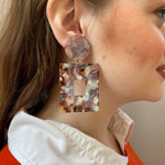 woman wearing Acrylic Square Drop Earrings in Fall Harvest, red, blue, brown and cream