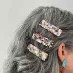 woman wearing acrylic hair clip set in light multicolor