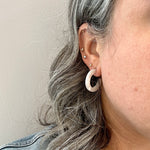 women wearing mini acrylic hoop earring in white 